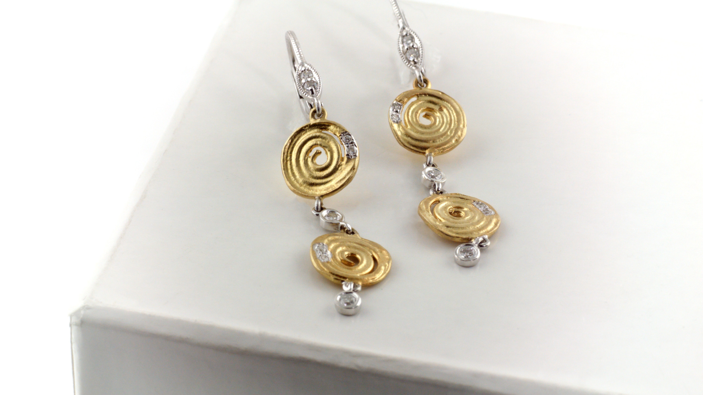 14K yellow gold earrings with white gold and diamond accents.