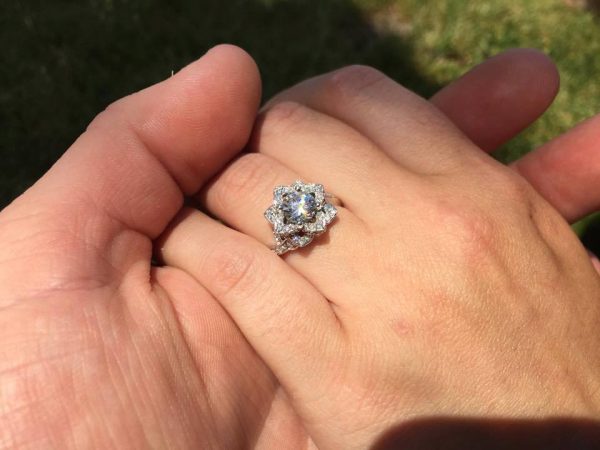 A Buffalo proposal with custom designed 14 k w. gold ring with a 1 ct. center stone & 92 hand set diamonds (+ 2 amethysts) from Barbara Oliver Jewelry 